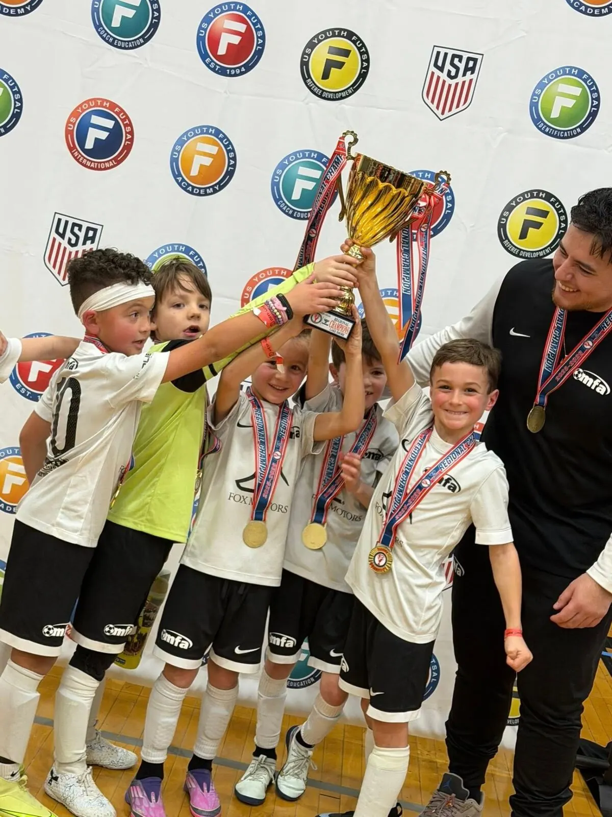 Players lifting the regional trophy